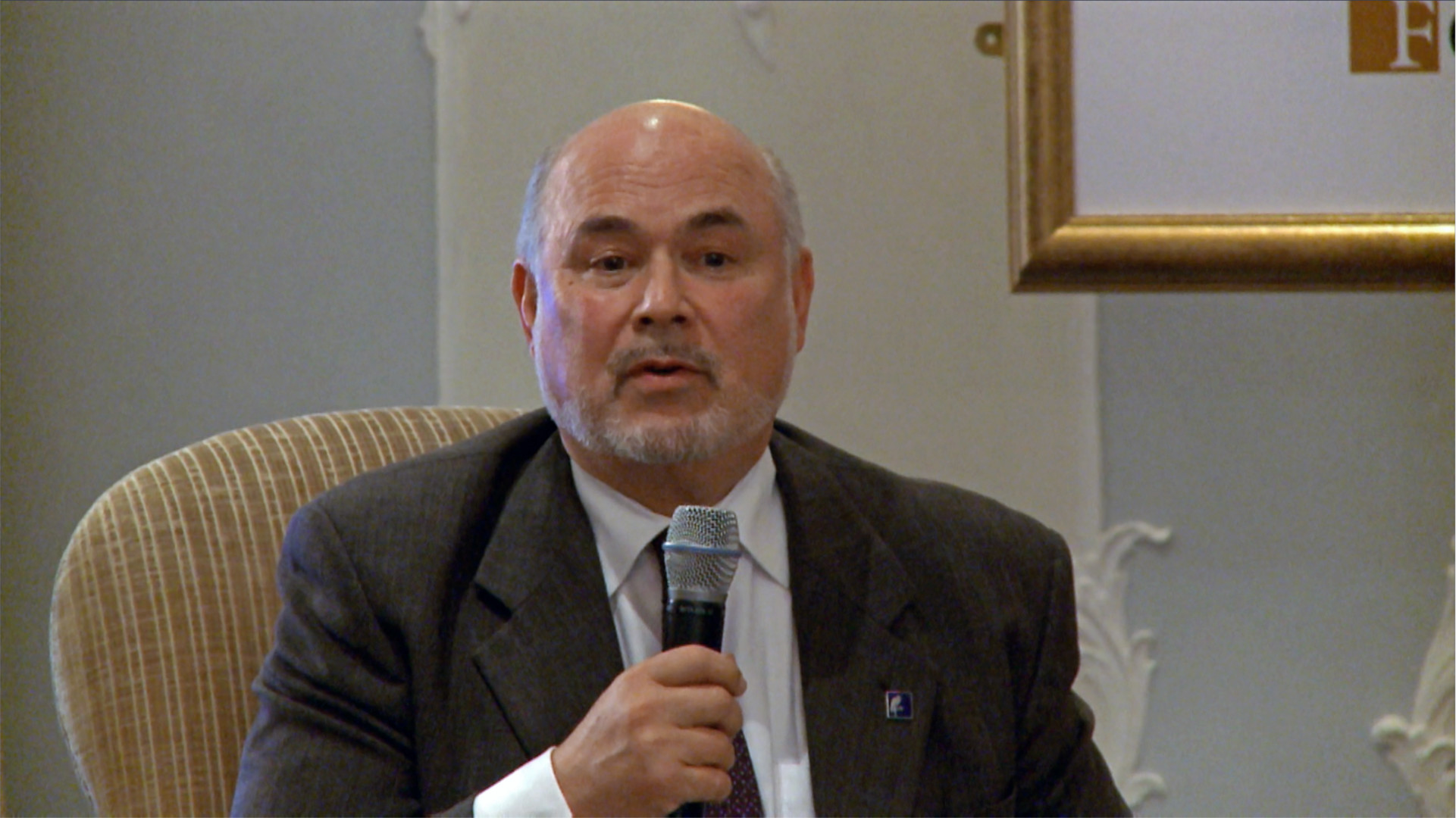 Jonathan Granoff Disparity film still, Jonathan Granoff speaking with microphone