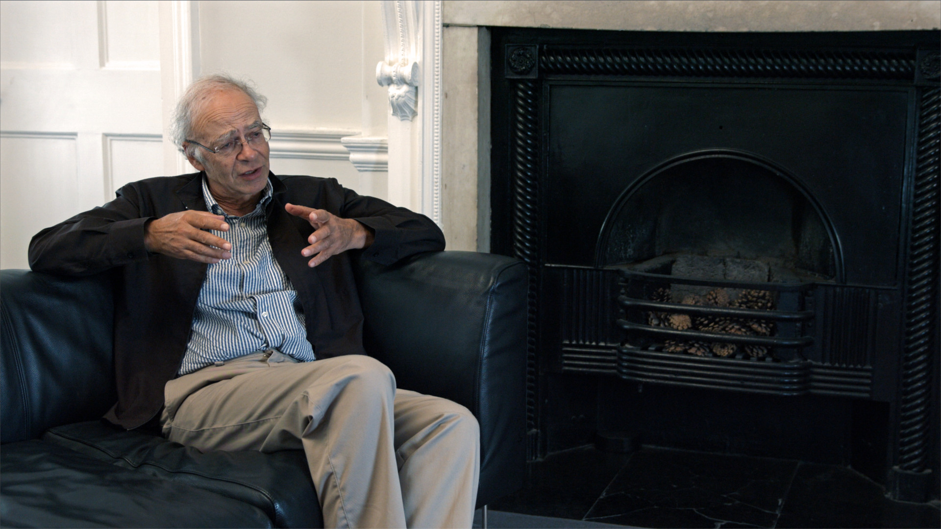 Peter Singer Disparity Film Still, Peter Singer sitting