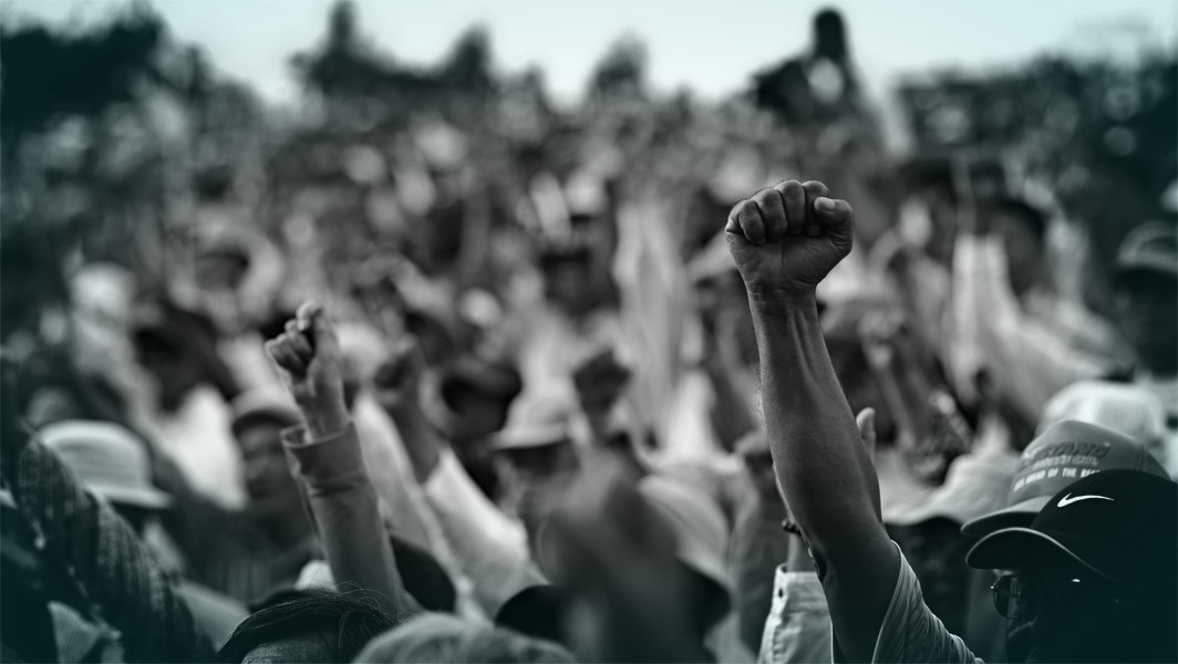 Aid Activists image Balck and white photo fists raised in air
