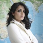 Renu Mehta in front of map 2